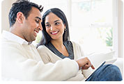 Man and Woman Viewing Tablet Computer